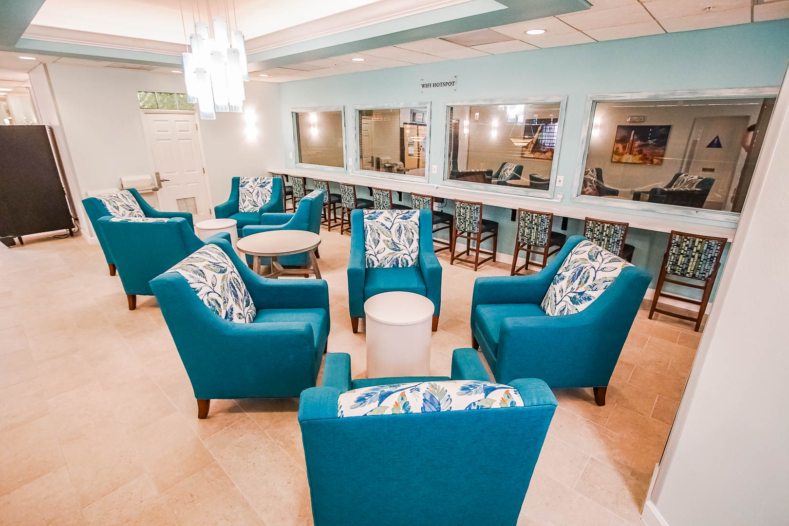 A modern resort lobby area with lounge at VRI's The Resort on Cocoa Beach in Florida.